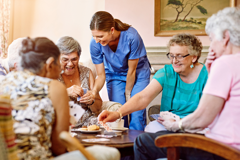 Nurse talking with group of senior women