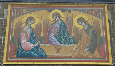 Holy Trinity banner on building